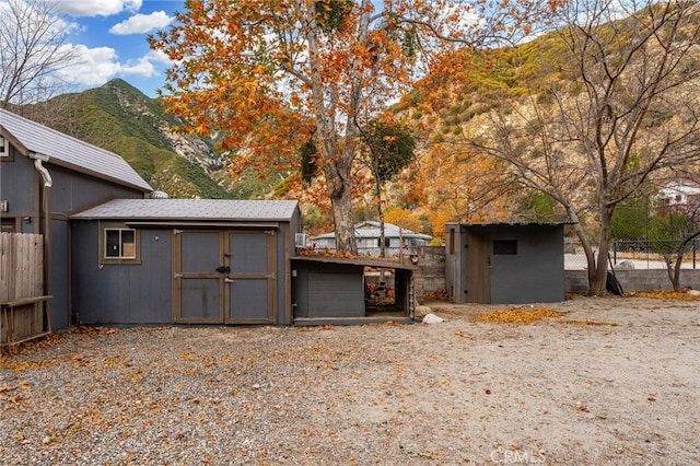 view of outdoor structure with a mountain view