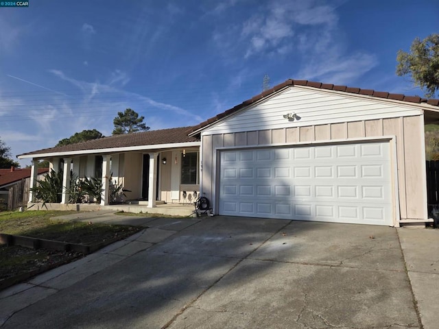 single story home featuring a garage