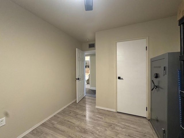 spare room with light wood-type flooring