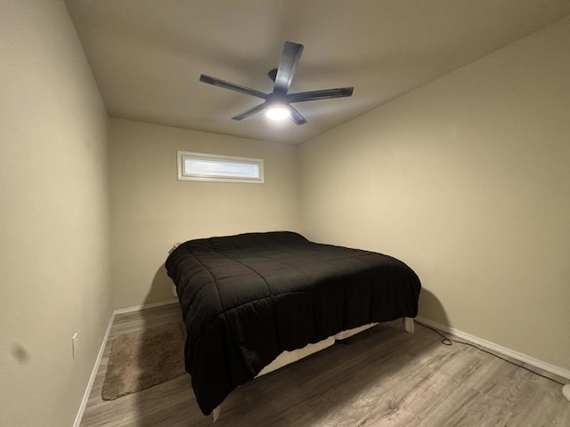 bedroom featuring ceiling fan and wood-type flooring