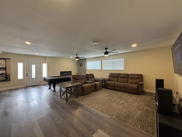 living room featuring ceiling fan, a healthy amount of sunlight, wood-type flooring, and pool table