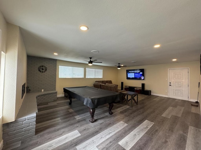 game room featuring ceiling fan, wood-type flooring, and billiards