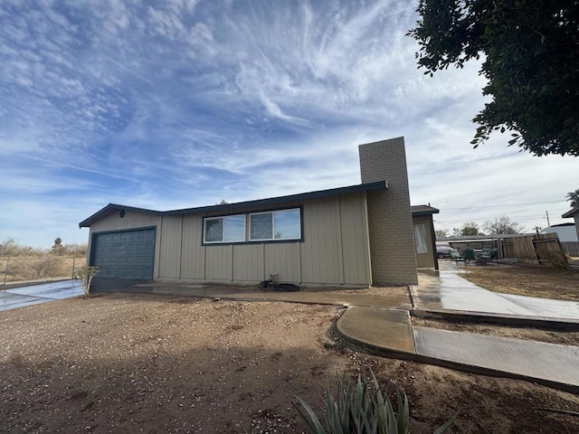 view of side of property with a garage