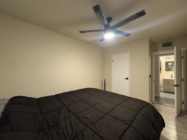 bedroom with ceiling fan and light hardwood / wood-style floors