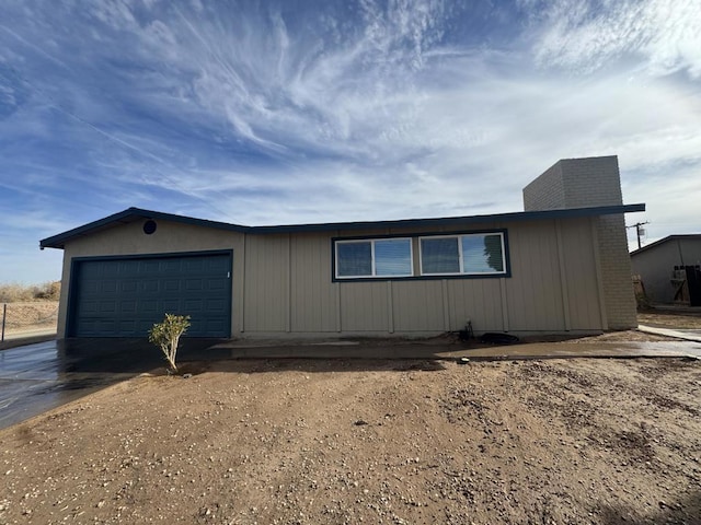 view of side of property featuring a garage