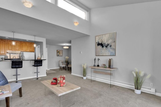 carpeted living room featuring a high ceiling