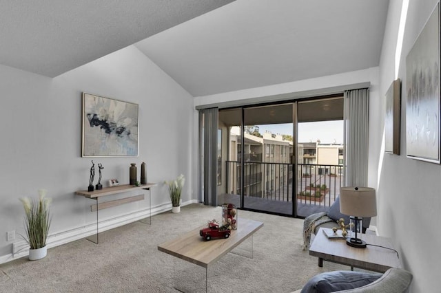 living room with vaulted ceiling and carpet