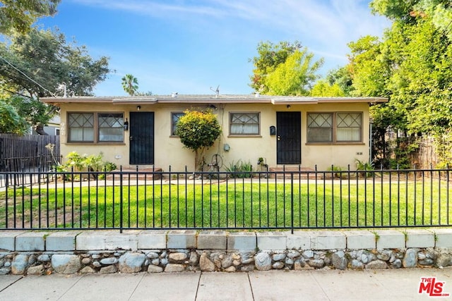 ranch-style home with a front yard