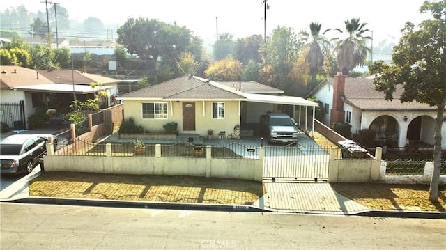 view of front of home featuring a carport