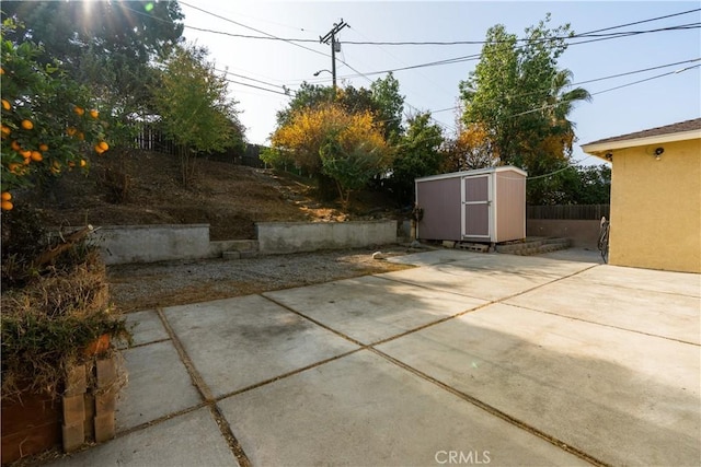 view of patio with a shed