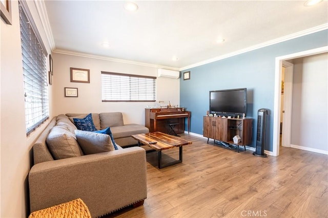 living room featuring a wall mounted air conditioner, light hardwood / wood-style flooring, and a healthy amount of sunlight