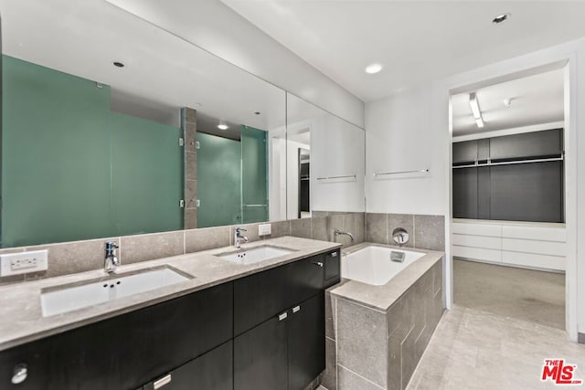 bathroom with a bathtub and vanity