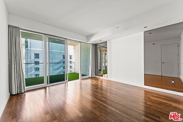 empty room featuring wood-type flooring