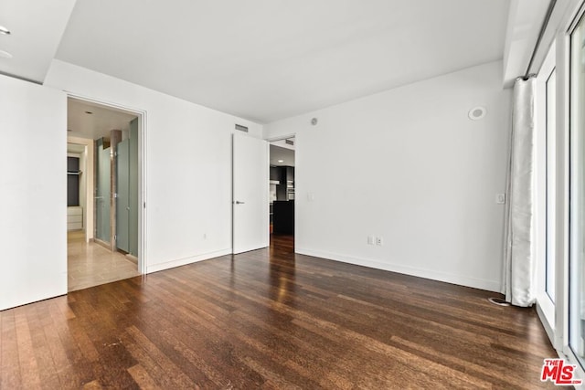 empty room featuring dark hardwood / wood-style floors