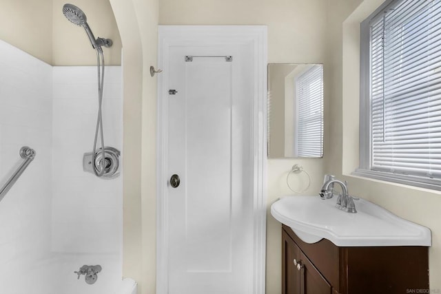 bathroom with vanity and a wealth of natural light