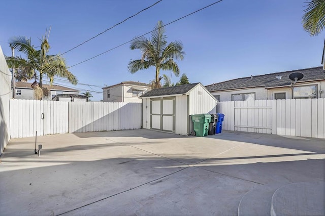 view of patio featuring a storage shed