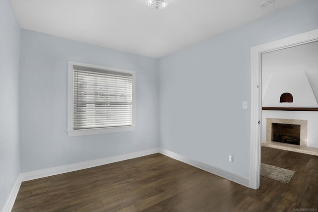 empty room featuring dark hardwood / wood-style flooring