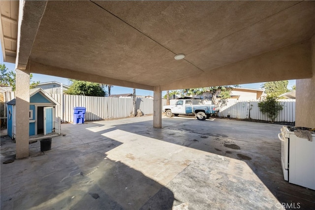 view of patio featuring a storage unit