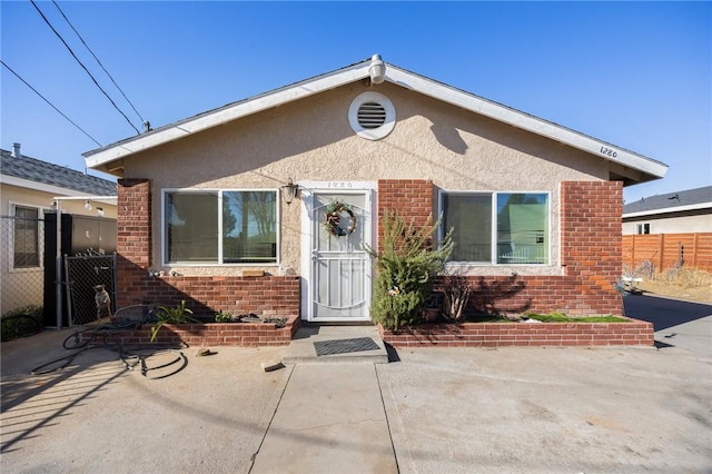 bungalow-style home featuring a patio area