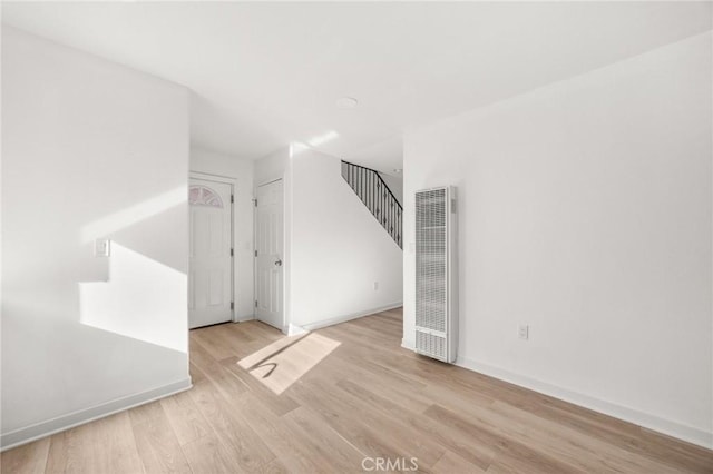 unfurnished room featuring light hardwood / wood-style flooring