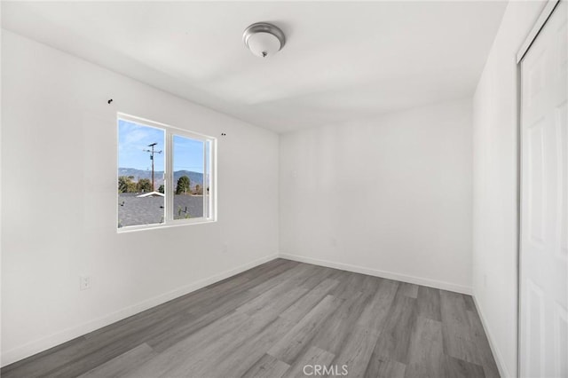 spare room featuring light hardwood / wood-style flooring