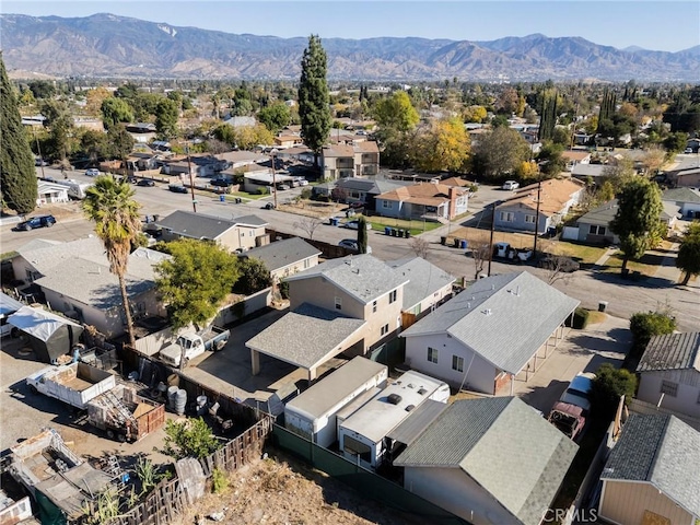 birds eye view of property featuring a mountain view