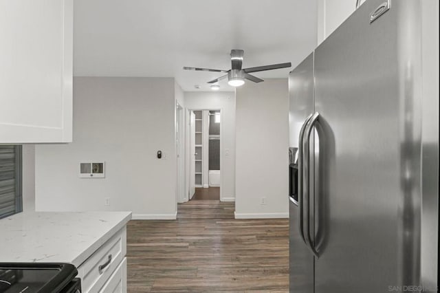 kitchen featuring light stone countertops, white cabinetry, ceiling fan, dark hardwood / wood-style floors, and stainless steel refrigerator with ice dispenser