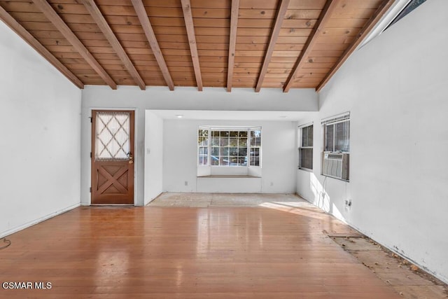 interior space with beam ceiling, light wood-type flooring, and wood ceiling