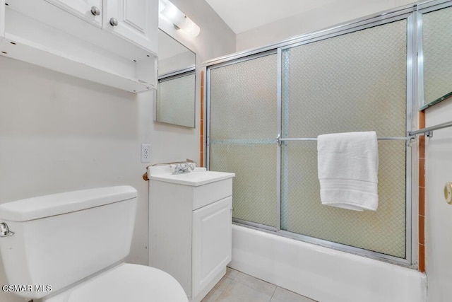 full bathroom with tile patterned flooring, toilet, combined bath / shower with glass door, and vanity