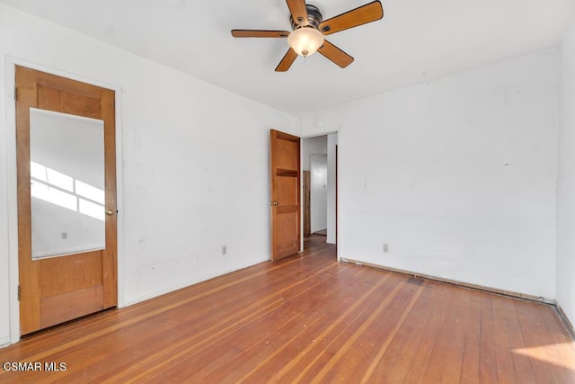 unfurnished room featuring hardwood / wood-style flooring and ceiling fan