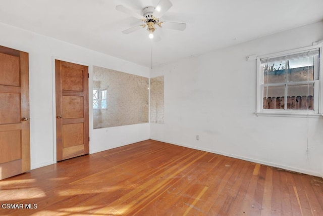 unfurnished room featuring hardwood / wood-style flooring and ceiling fan