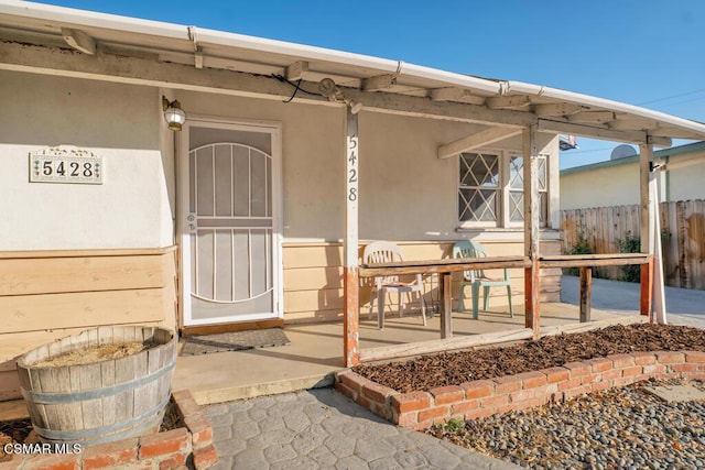 entrance to property with a patio area