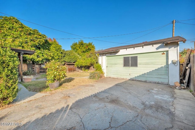 rear view of property with an outbuilding