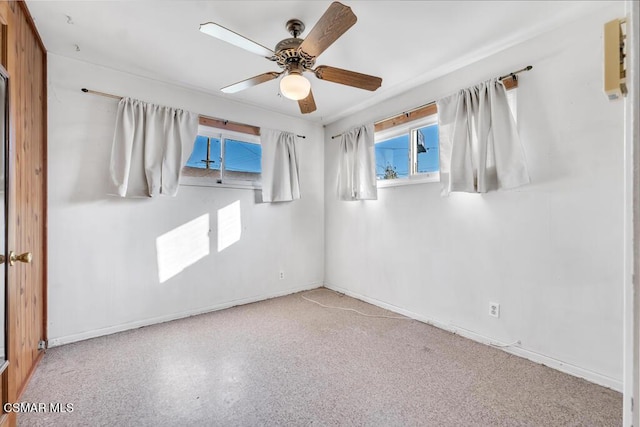 unfurnished room featuring ceiling fan