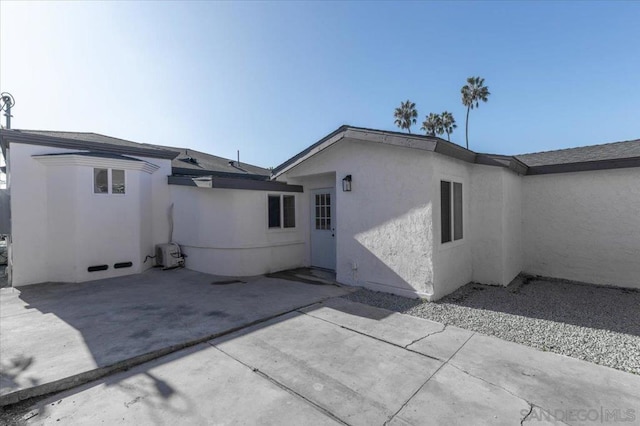 back of property with a patio