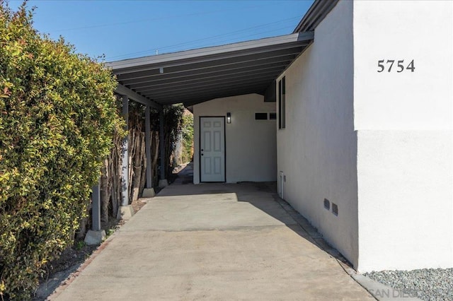 view of car parking with a carport