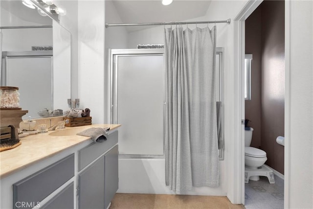 full bathroom featuring shower / bath combination with curtain, vanity, and toilet