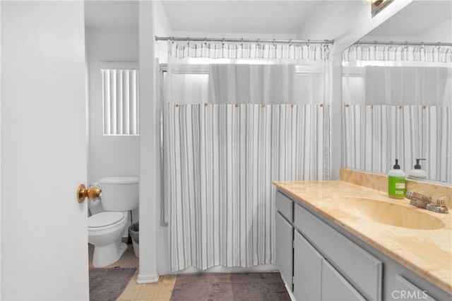 bathroom with tile patterned floors, vanity, toilet, and a shower with shower curtain