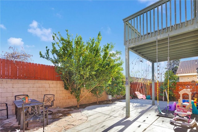 view of patio featuring a playground