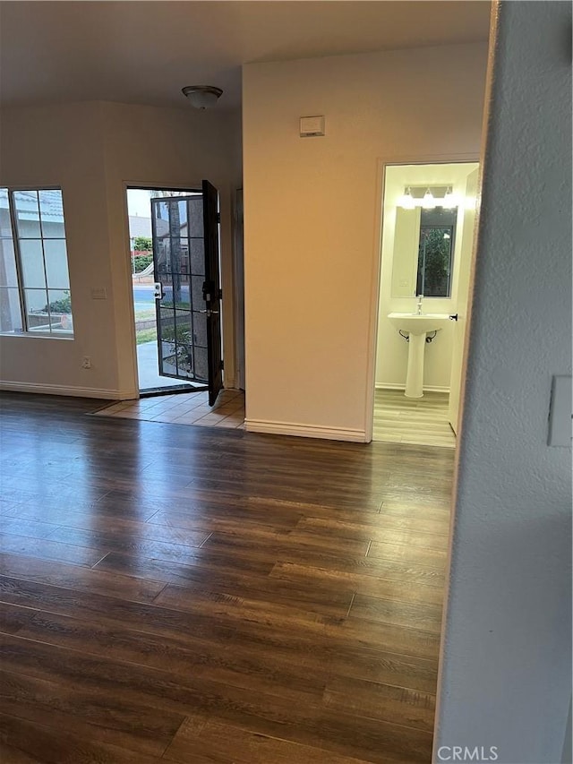 empty room featuring dark hardwood / wood-style flooring