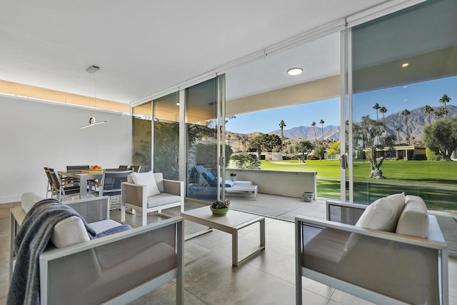 view of patio / terrace with a mountain view and an outdoor hangout area