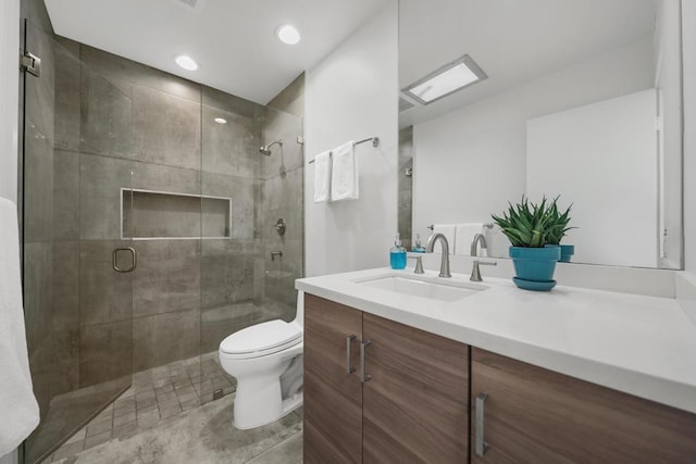 bathroom featuring walk in shower, tile patterned floors, vanity, and toilet