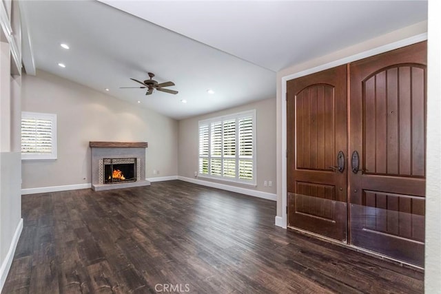 entrance foyer with a wealth of natural light, dark hardwood / wood-style flooring, ceiling fan, and vaulted ceiling