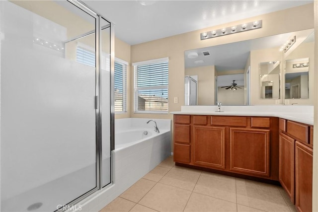 bathroom with tile patterned floors, ceiling fan, vanity, and independent shower and bath