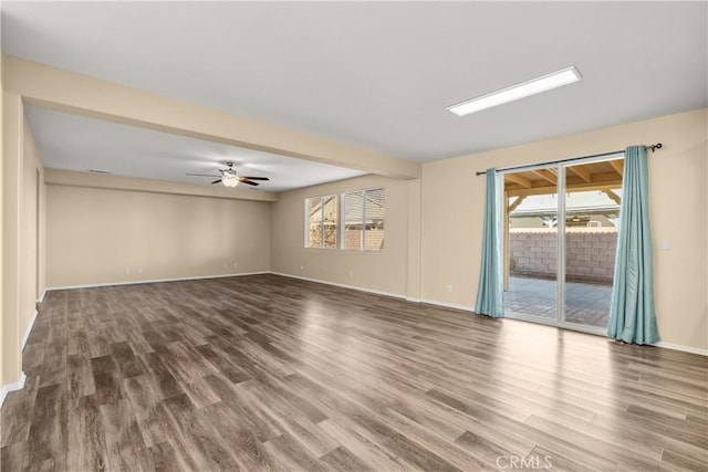 empty room featuring ceiling fan and hardwood / wood-style floors