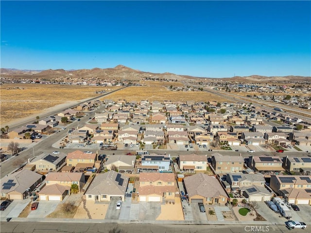 birds eye view of property featuring a mountain view