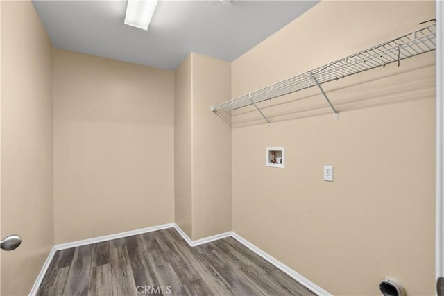 washroom with hookup for a washing machine and hardwood / wood-style flooring