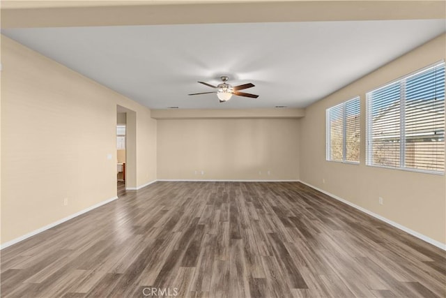 unfurnished room featuring ceiling fan and hardwood / wood-style flooring