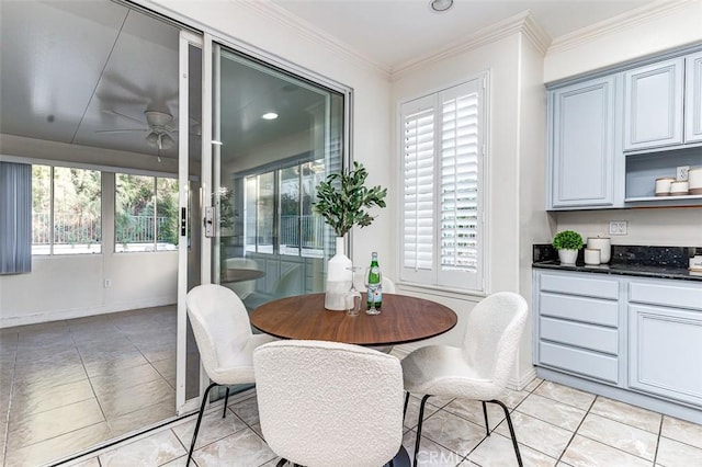 dining area with ceiling fan, crown molding, and light tile patterned floors