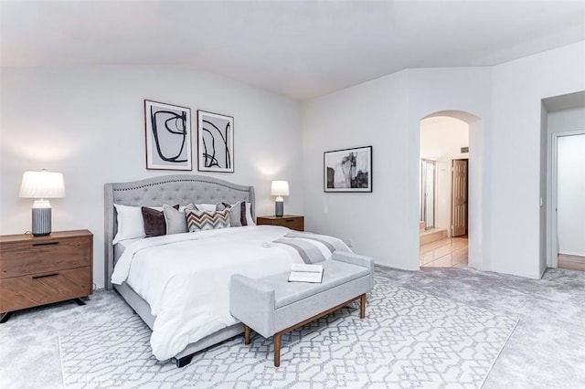 bedroom featuring carpet floors and lofted ceiling